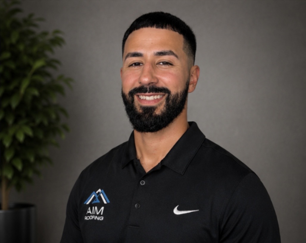 AIM Roofing owner in a branded polo, serving homeowners across Mesquite and DFW